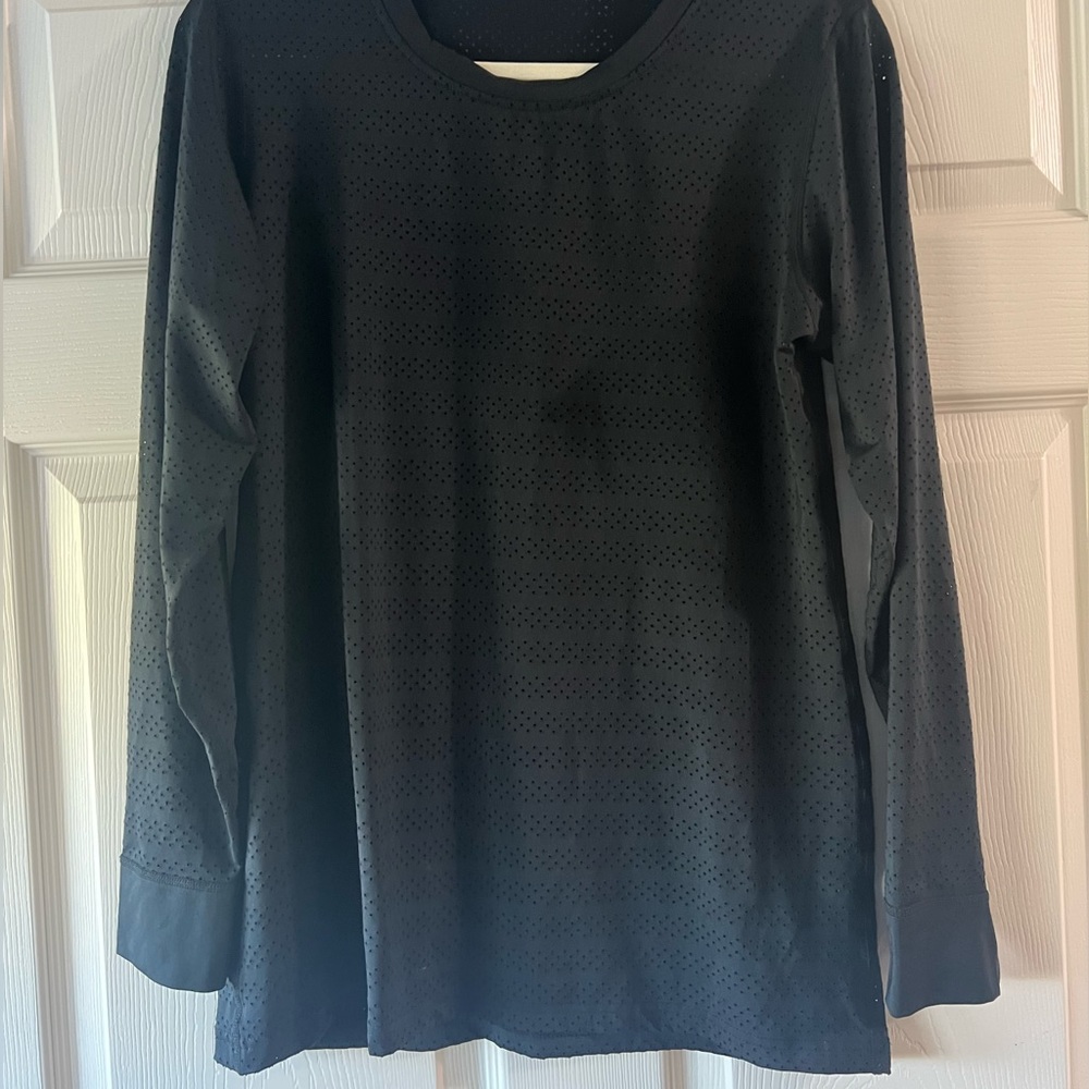 Zyia active woman’s chill perforated, mesh, long sleeve black top.